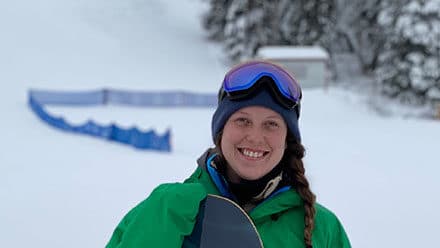 Girl in snow gear smiling